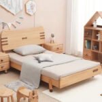 Modern minimalist kids' single platform bed crafted from solid wood, featuring a slotted headboard and an integrated roll-out trundle bed frame base in a bright children's bedroom.