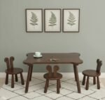 dark walnut solid wood kids activity table and chairs set, featuring a rectangular study table with rounded corners paired with three matching rabbit eared wooden chairs