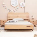 Direct front view of the slat-accent wooden single bed frame centered between two matching double-drawer nightstands.