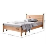 Front view of a classic solid wood children's low platform bed frame with a simple rectangular headboard, layered with cozy gray bedding, indicating a 125cm width layout.