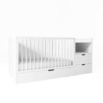 Clean studio product shot of a white 3-in-1 convertible baby crib featuring vertical slatted guardrails, an attached 2-drawer side storage unit, and a pull-out base drawer.