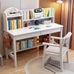 White wooden children's study table and chair set, featuring a multi-tier upper book organizer hutch, two drawers, side bag hook, and lower storage rack.