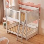 Modern white wooden bunk bed frame with exposed slatted mattress bases, high top safety guardrails, and an inclined front ladder set against a soft pink decorative arch wall.