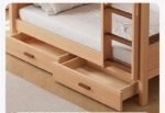 Detailed close-up shot showing two spacious pull-out under-bed storage drawers with integrated wooden handles beneath a natural wood bunk bed frame.