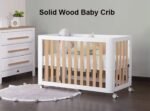 Modern two-tone white outer frame and natural wood slatted solid wood baby crib on wheels, featuring a text overlay reading "Solid Wood Baby Crib".