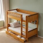 Amyzel classic premium pine solid wood twin bunk bed, features a built-in vertical ladder, protective top guardrails, a compact inner display shelf, and dual pull-out under-bed storage drawers, styled against a soft sage green wall.