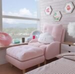 Pink flannel tufted lounge chair and ottoman dimension chart highlighting plush dual cushions and natural wood leg details.