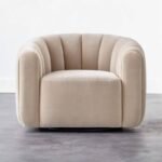 Cream beige channel-tufted velvet barrel swivel armchair front view product shot