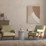 Camel tan leather mid-century modern armchair featuring thick padded armrests and dark wood V-frame legs on a light background