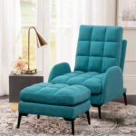 Modern teal blue grid-tufted recliner and ottoman set styled in a contemporary living room next to a brass floor lamp.