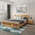 Wide room shot showing the full natural oak storage bed in a minimalist bedroom setting.