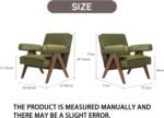 Pair of olive green mid-century modern upholstered armchairs with angled wooden V-frame legs in a neutral living room