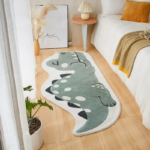 Whimsical sage green dinosaur shaped runner rug for kids bedroom, soft plush cartoon dino nursery floor mat arranged next to a modern low platform platform bed.