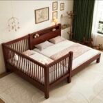 Sophisticated dark walnut-finished solid wood kids' bed extension positioned flush against a master bed, creating a safe and stylish co-sleeping setup.